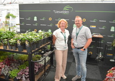 Evelien and Teunis Versteeg of Kwekerij de Liesvelden, with an old auction trolley on the left, on tw